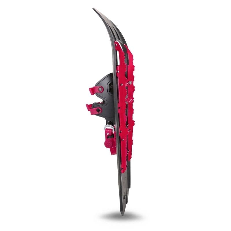 Dark composite snowshoe with pink binding straps and serrated traction rails, photographed on white.