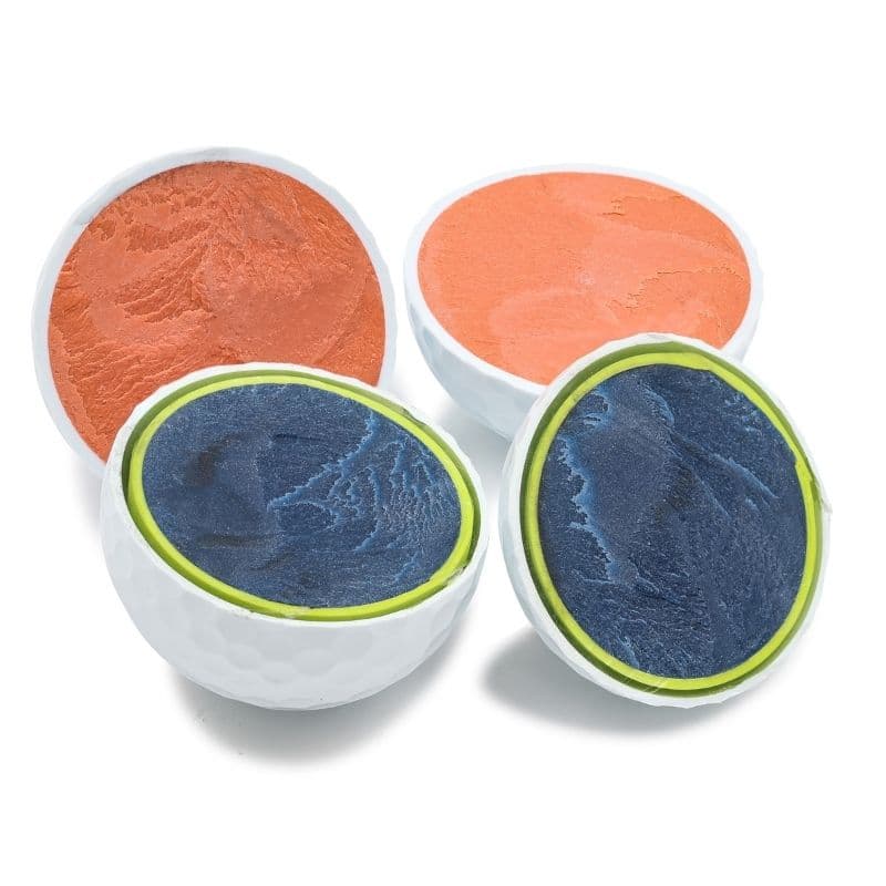 Two golf balls cut in half showing blue-green and orange cores, on white.